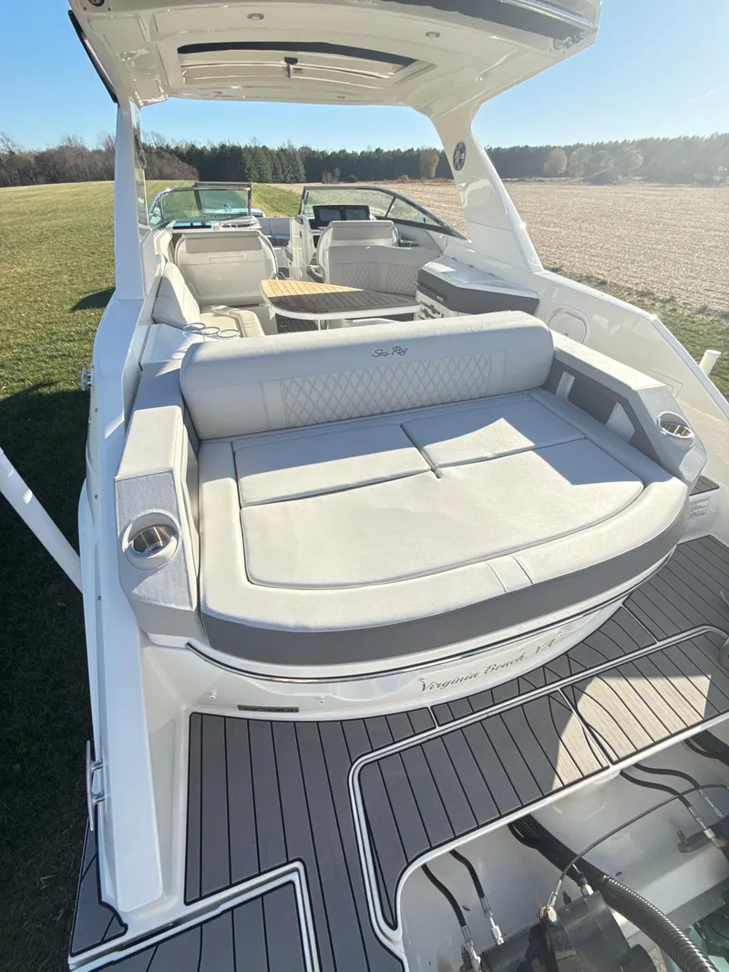 Slide: The Image of 2023 Sea Ray SLX 310 OB boat with spacious seating and modern design. - 13