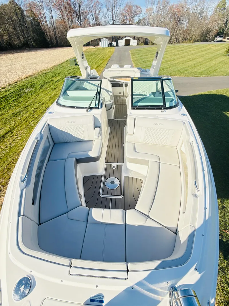Slide: The Image of 2023 Sea Ray SLX 310 OB boat with spacious seating and sleek design. - 38
