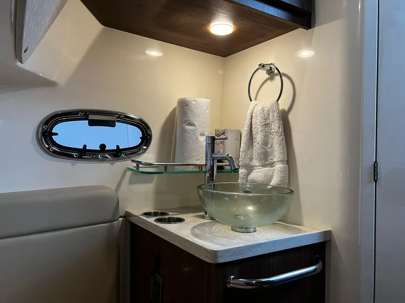 Slide: The Image of Luxurious bathroom interior of 2019 Boston Whaler 380 Outrage with modern sink and fixtures. - 24