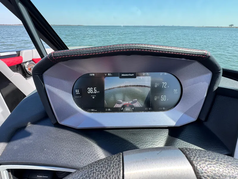 Slide: The Image of Dashboard of 2022 MasterCraft XT24 boat with digital display, showing speed and navigation. - 14