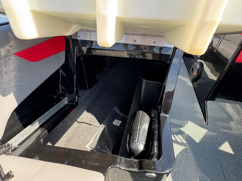 Slide: The Image of 2022 MasterCraft XT24 interior storage compartment with sleek design and modern features. - 15