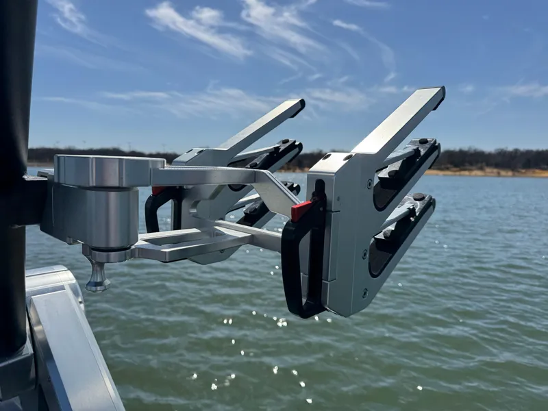 Slide: The Image of 2022 MasterCraft XT24 boat accessory on water, under clear blue sky. - 29