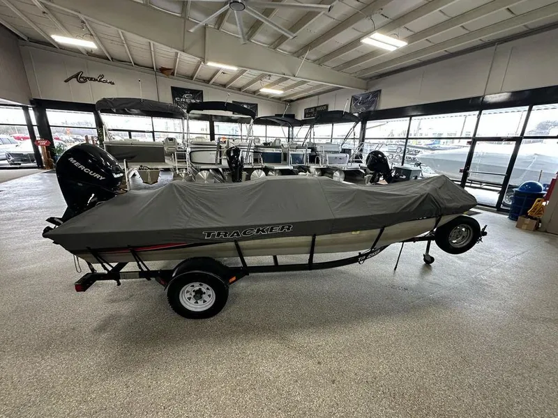 Slide: The Image of 2012 Bass Tracker Panfish 16 boat with cover in showroom. - 10