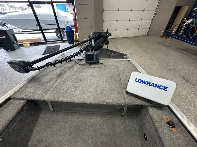 Slide: The Image of 2012 Bass Tracker Panfish 16 boat interior with Lowrance fish finder and trolling motor. - 3