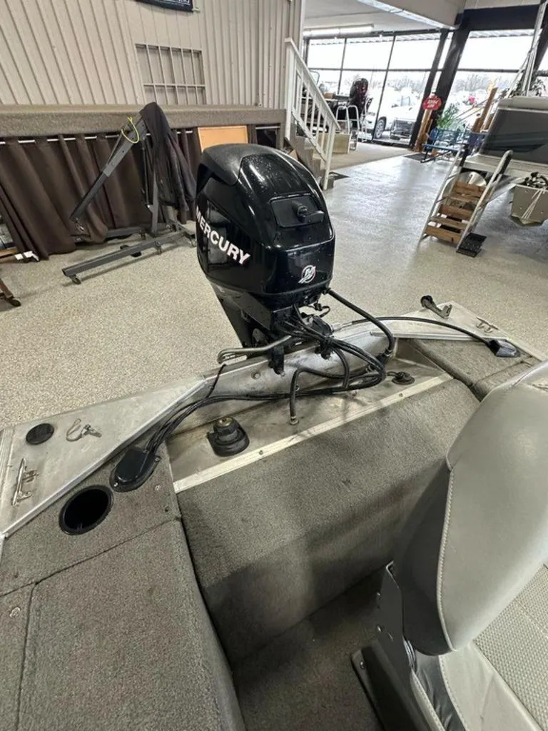 Slide: The Image of 2012 Bass Tracker Panfish 16 boat with Mercury outboard motor in showroom. - 8