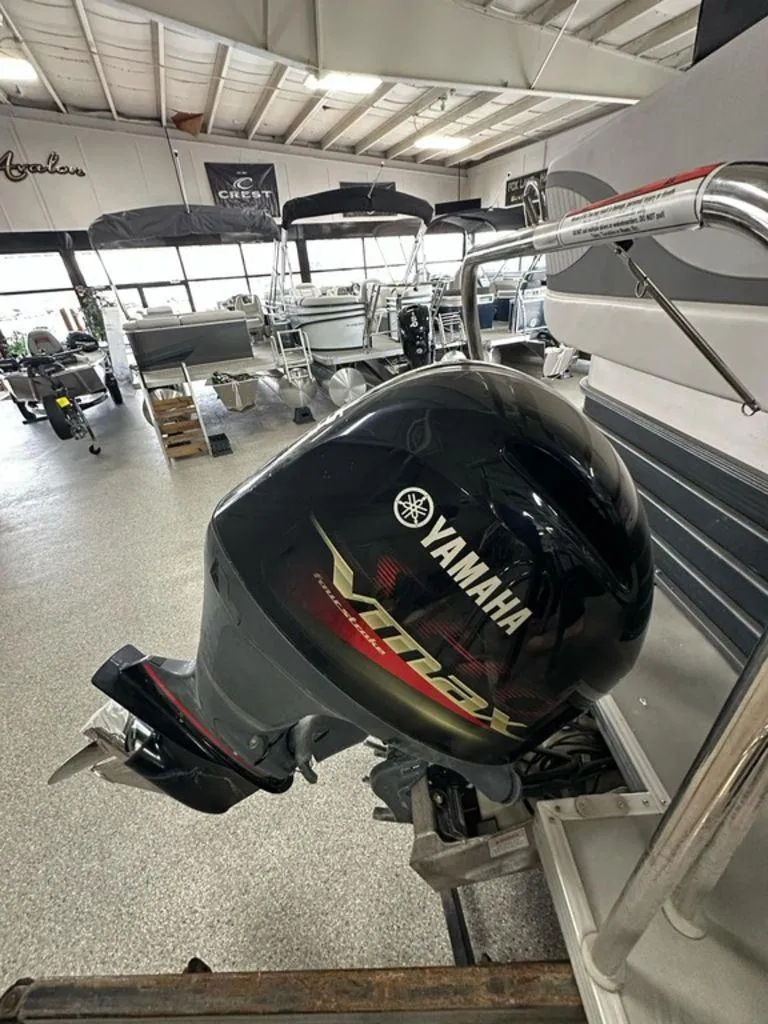 Slide: The Image of Yamaha VMAX outboard motor on a 2017 Crest II 230 L pontoon boat in showroom. - 3