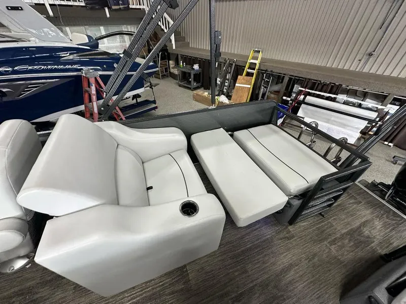 Slide: The Image of 2022 Crest Classic LX 220 SLRC CPT boat interior with gray seating and cup holder. - 15