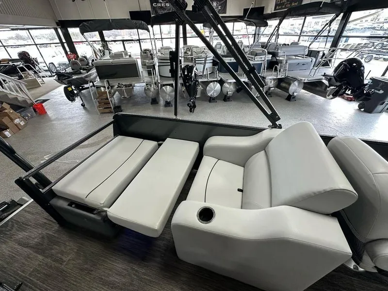 Slide: The Image of 2022 Crest Classic LX 220 SLRC CPT interior with gray seating in showroom. - 17
