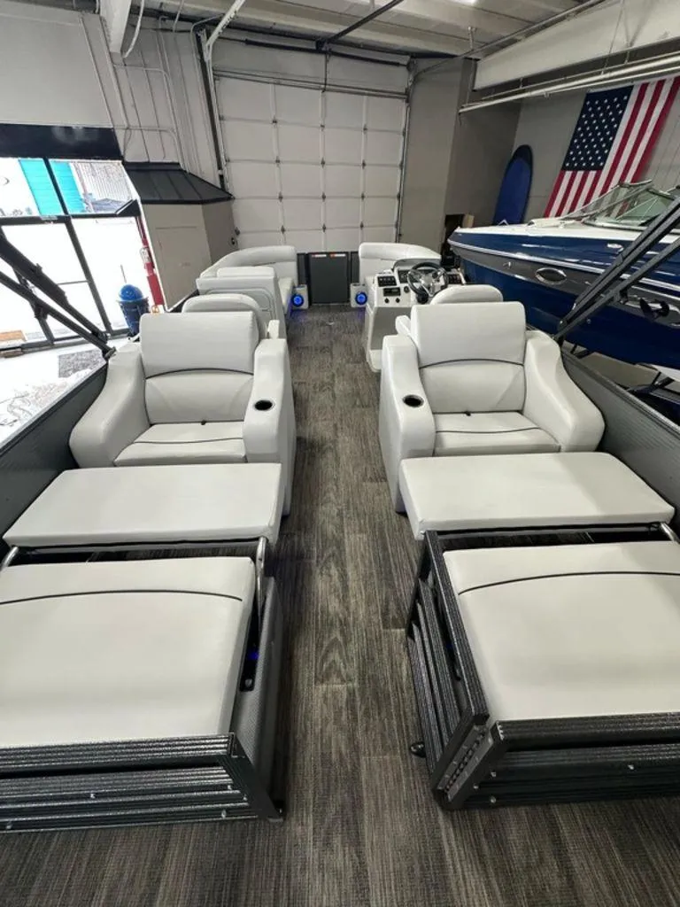 Slide: The Image of 2022 Crest Classic LX 220 SLRC CPT pontoon boat interior with luxurious seating. - 18