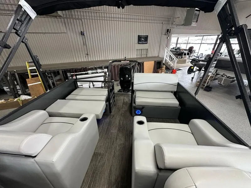 Slide: The Image of 2022 Crest Classic LX 220 SLRC CPT pontoon boat interior with gray seating and cup holders. - 19
