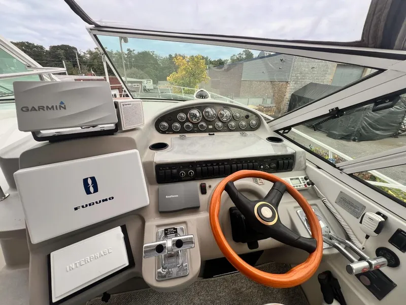 Slide: The Image of 2001 Cruisers Yachts 3870 Express helm with Garmin and Furuno navigation systems. - 9