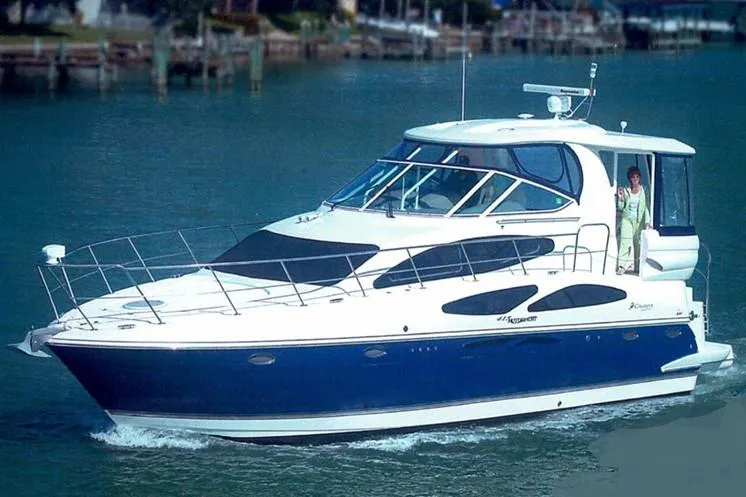 Slide: The Image of 2006 Cruisers Yachts 415 Express Motoryacht cruising on calm waters. - 0