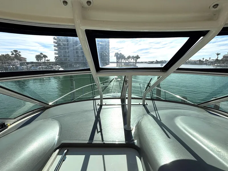 Slide: The Image of 2006 Cruisers Yachts 415 Express Motoryacht helm with waterfront view. - 16
