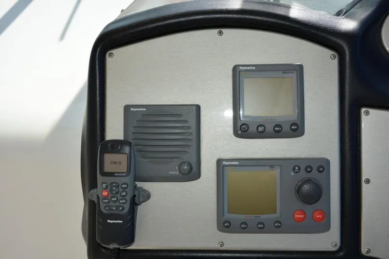 Slide: The Image of Control panel of 2006 Cruisers Yachts 415 Express Motoryacht with navigation equipment. - 21