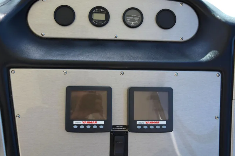 Slide: The Image of 2006 Cruisers Yachts 415 Express Motoryacht dashboard with Yanmar engine displays. - 22