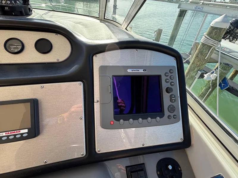 Slide: The Image of Control panel of 2006 Cruisers Yachts 415 Express Motoryacht with navigation equipment. - 23