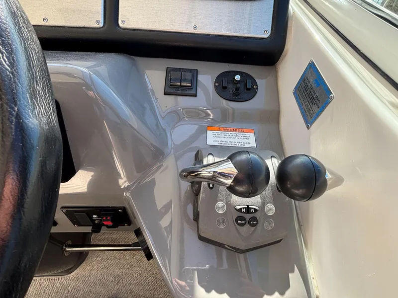 Slide: The Image of 2006 Cruisers Yachts 415 Express Motoryacht helm controls and dashboard detail. - 26