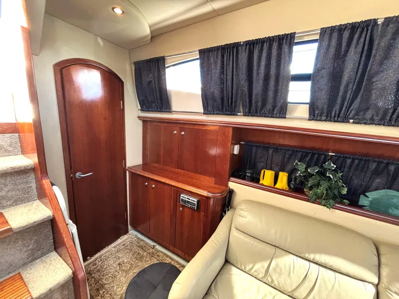 Slide: The Image of Interior of 2006 Cruisers Yachts 415 Express Motoryacht with wood cabinetry and seating. - 31