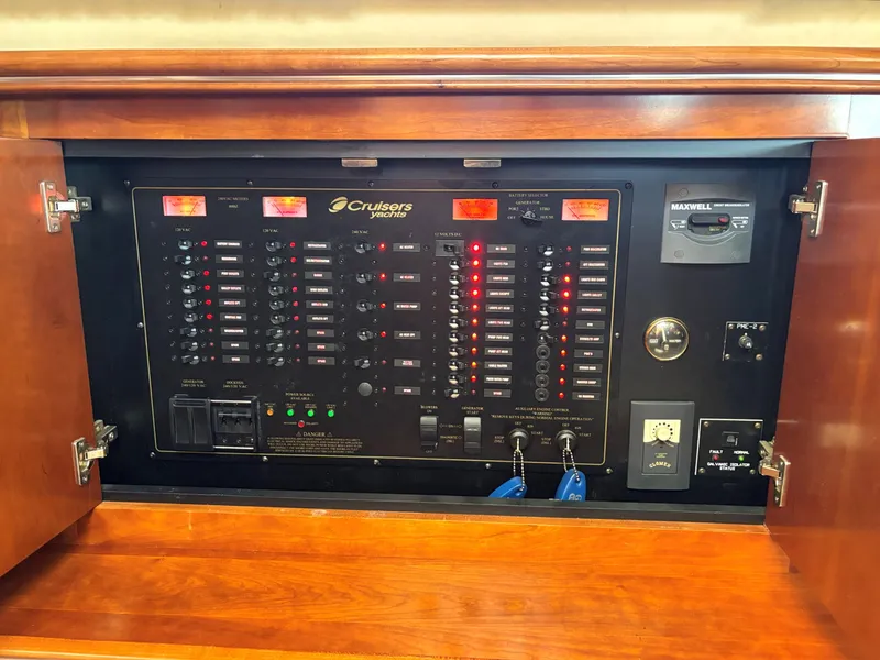 Slide: The Image of Electrical panel of 2006 Cruisers Yachts 415 Express Motoryacht, featuring switches and controls. - 34