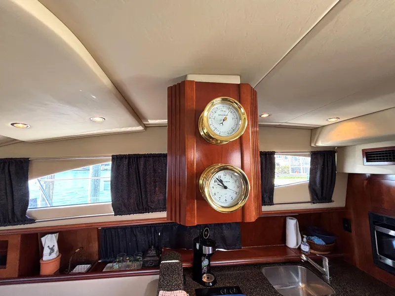 Slide: The Image of Interior of 2006 Cruisers Yachts 415 Express Motoryacht with wooden panel and brass instruments. - 42