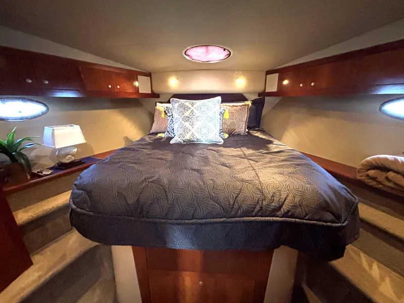 Slide: The Image of Luxurious bedroom in 2006 Cruisers Yachts 415 Express Motoryacht with elegant bedding. - 44
