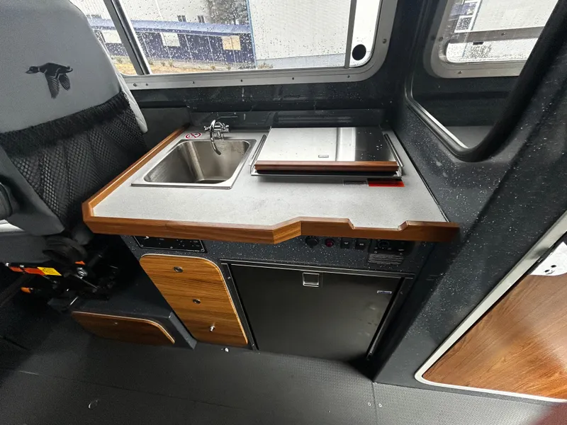 Slide: The Image of Interior of 2025 Duckworth 30 XL boat with kitchenette and sink. - 10
