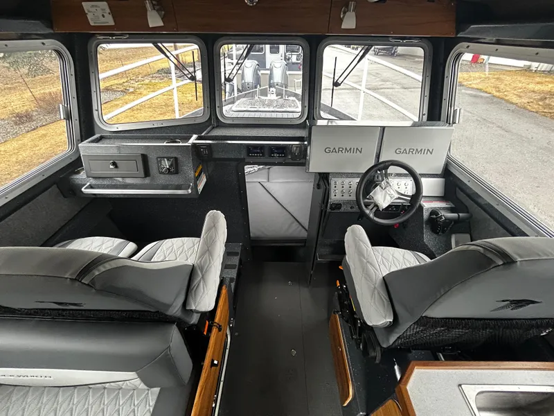 Slide: The Image of Interior of 2025 Duckworth 30 XL boat with Garmin navigation system and modern seating. - 11