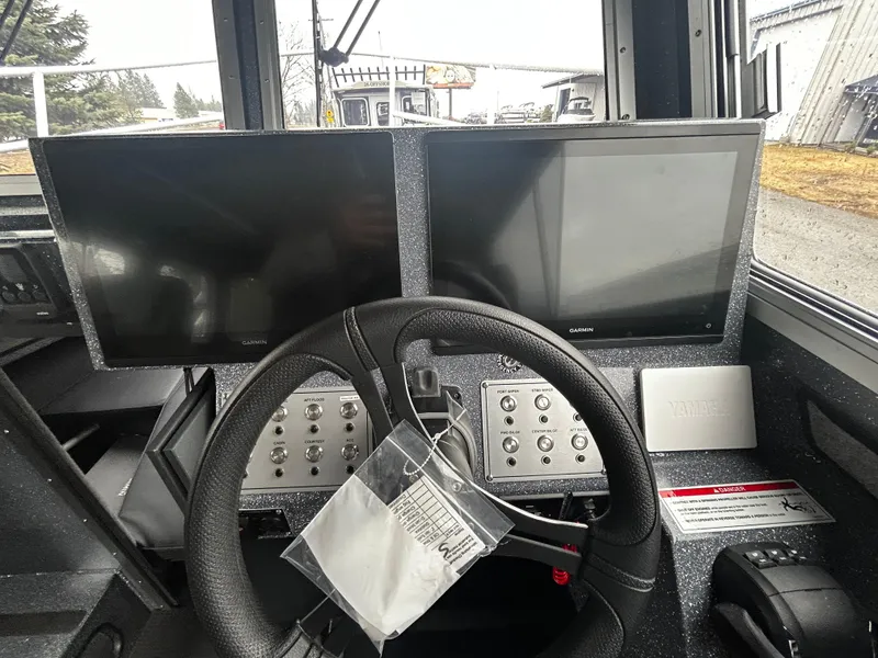 Slide: The Image of Control panel of 2025 Duckworth 30 XL boat with dual Garmin screens. - 13