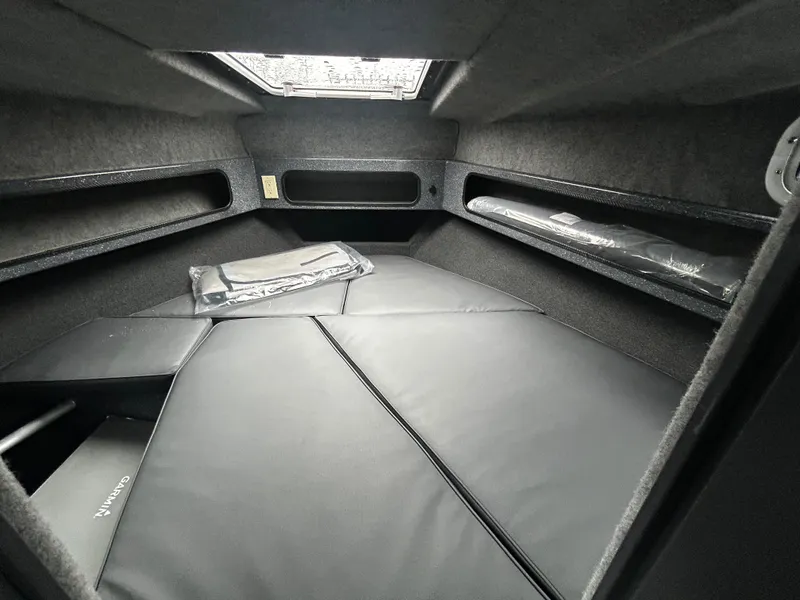 Slide: The Image of Interior cabin of 2025 Duckworth 30 XL boat, featuring cushioned seating and storage compartments. - 15