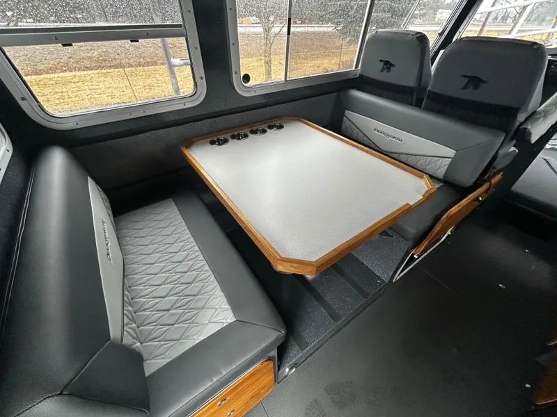 Slide: The Image of Interior of 2025 Duckworth 30 XL boat with seating and table. - 9