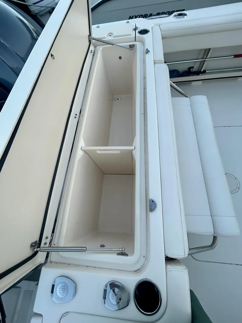 Slide: The Image of 2021 Grady-White Express 330 boat storage compartment, open and empty, showcasing interior space. - 15