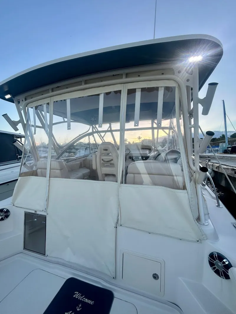 Slide: The Image of 2021 Grady-White Express 330 boat with covered cockpit at marina. - 17