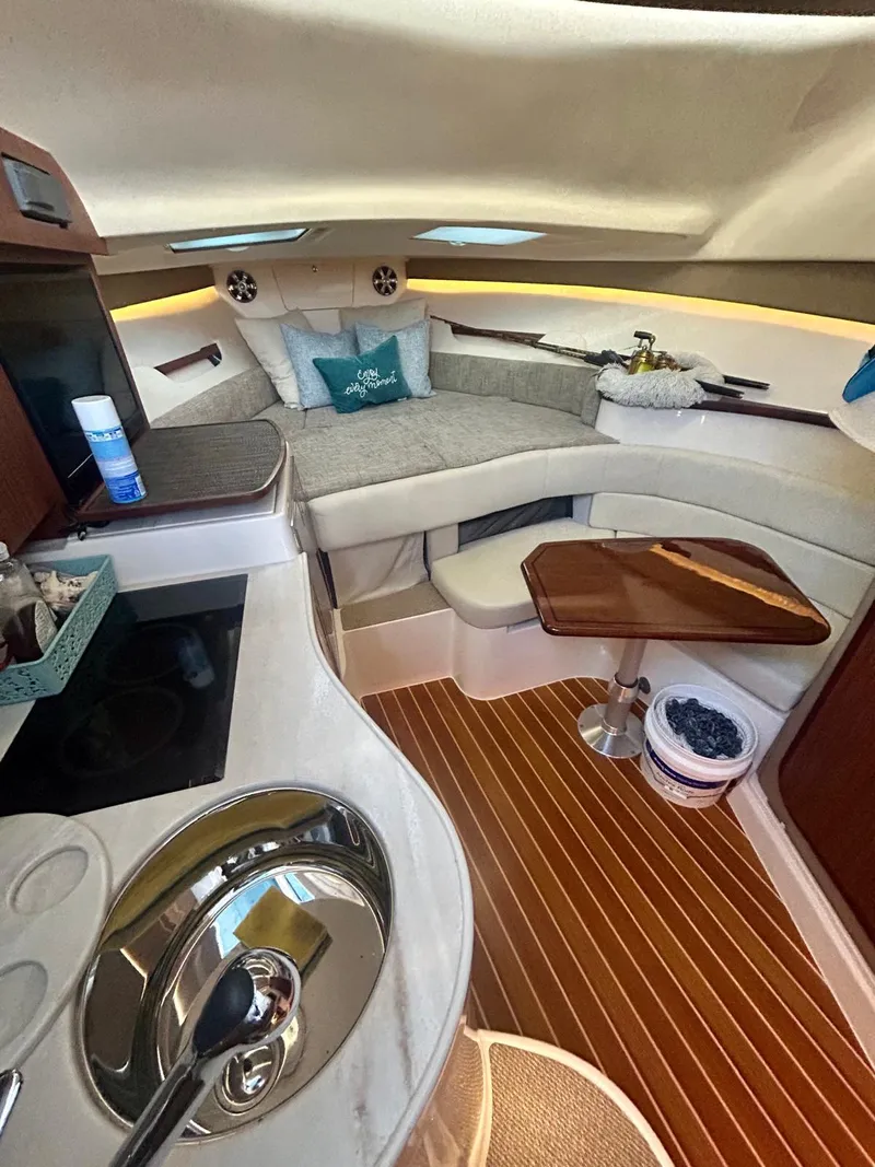 Slide: The Image of 2021 Grady-White Express 330 cabin interior with modern amenities and wooden flooring. - 19
