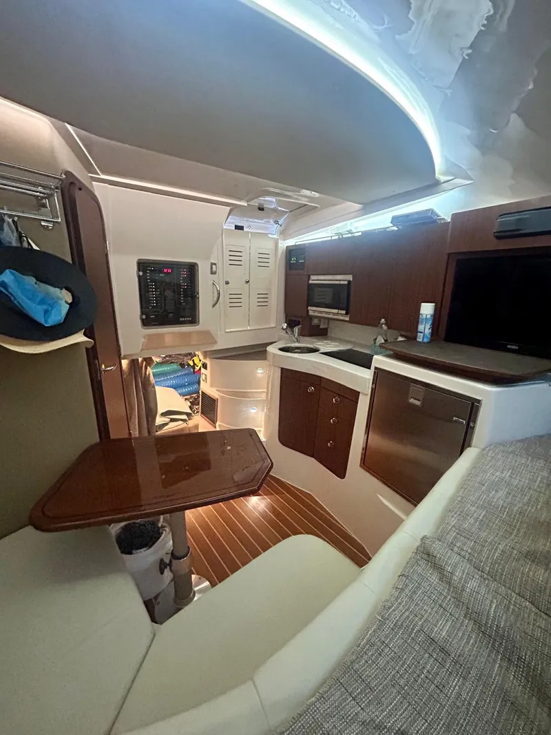 Slide: The Image of 2021 Grady-White Express 330 cabin interior with modern amenities and sleek design. - 20