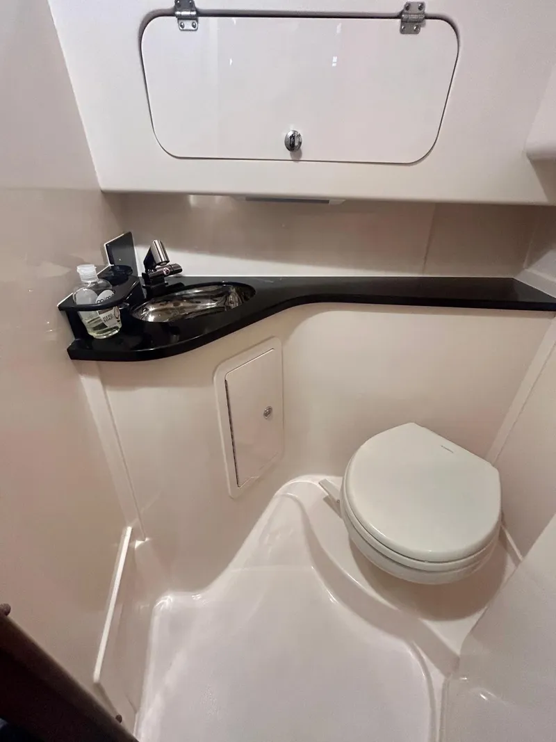 Slide: The Image of 2021 Grady-White Express 330 boat bathroom with sink and toilet. - 22