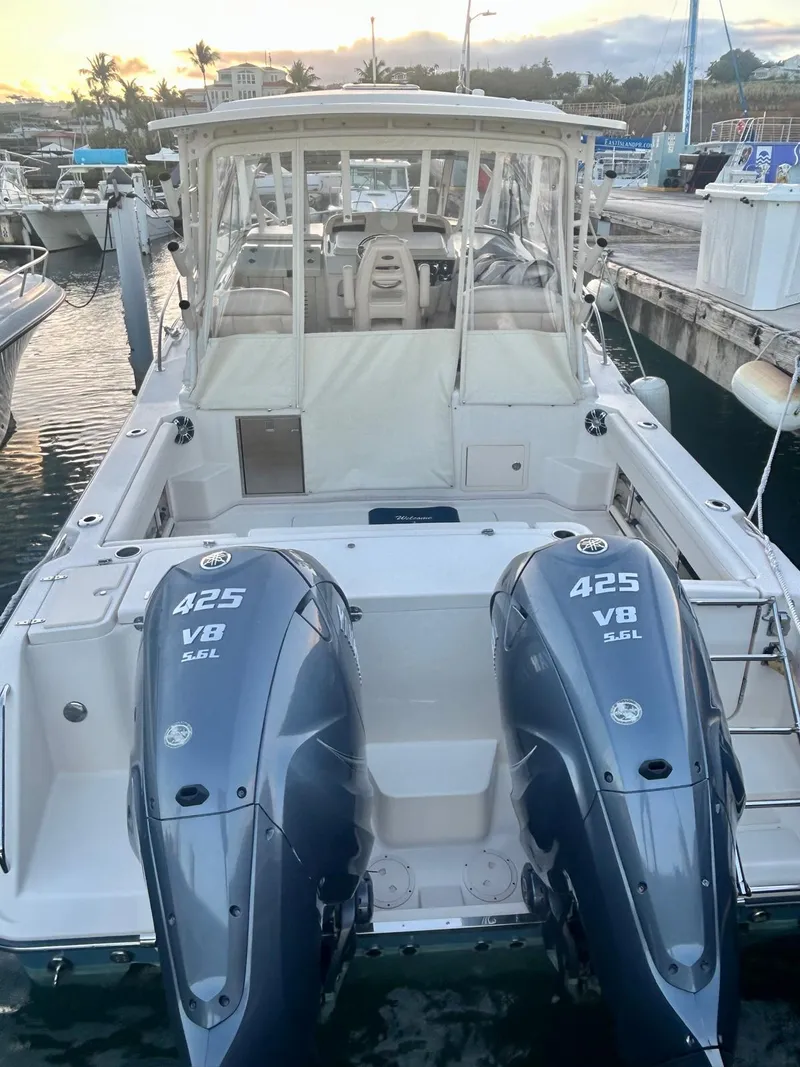 Slide: The Image of 2021 Grady-White Express 330 boat with twin 425 V8 engines docked at marina. - 8