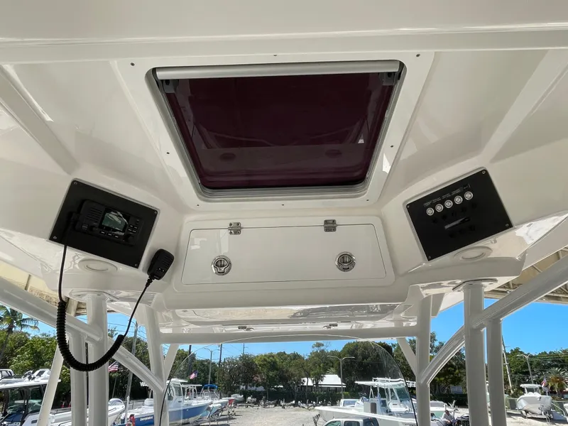 Slide: The Image of 2020 Sea Fox 328 Commander boat interior with control panels and hatch. - 11