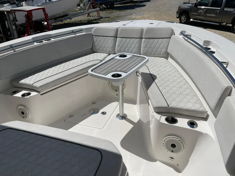 Slide: The Image of 2020 Sea Fox 328 Commander boat interior with cushioned seating and table. - 13