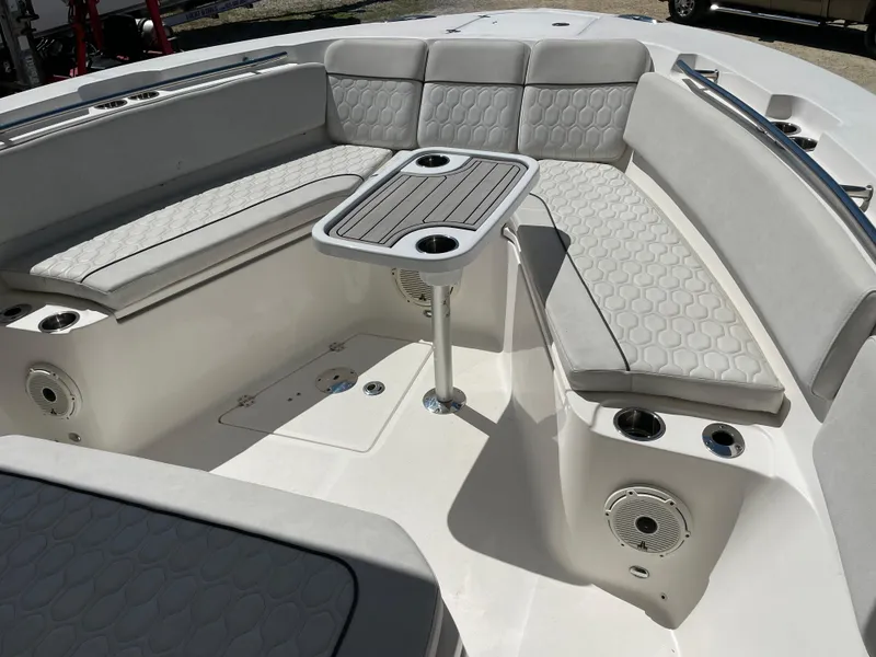 Slide: The Image of 2020 Sea Fox 328 Commander boat interior with cushioned seating and table. - 14