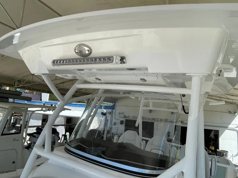 Slide: The Image of 2020 Sea Fox 328 Commander boat with T-top and windshield, showcasing modern design. - 17
