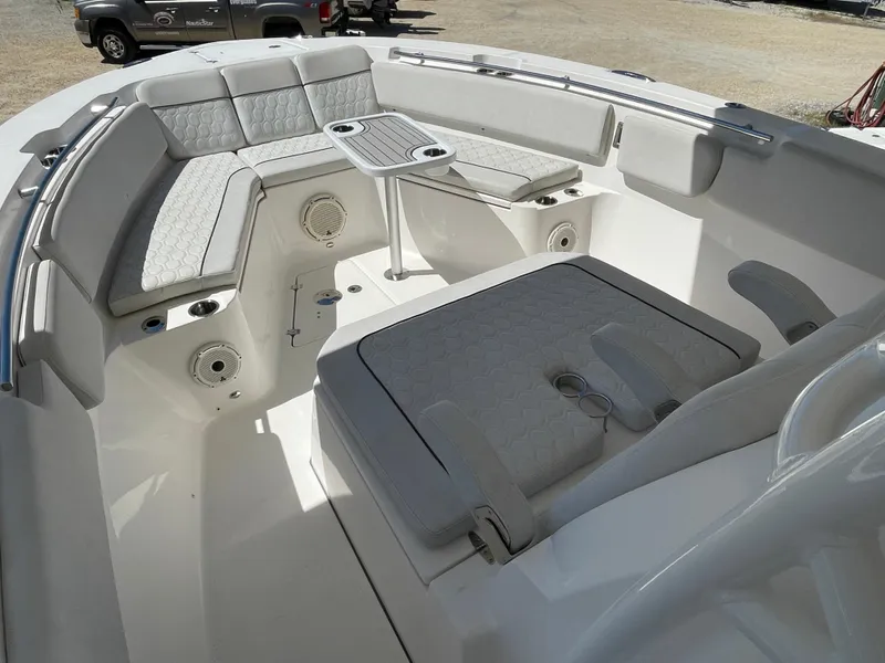 Slide: The Image of 2020 Sea Fox 328 Commander boat interior with cushioned seating and table. - 19