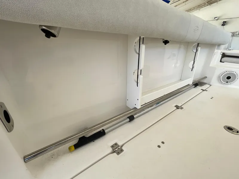 Slide: The Image of 2020 Sea Fox 328 Commander interior with rod storage and cushioned seating. - 27