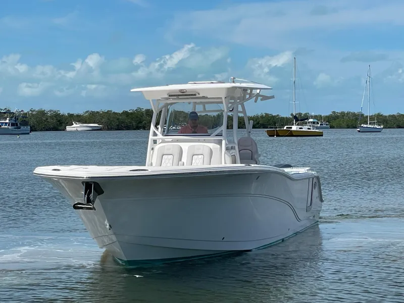 Slide: The Image of 2020 Sea Fox 328 Commander boat cruising on a calm, scenic waterway. - 3