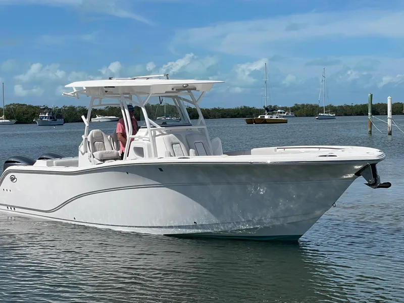 Slide: The Image of 2020 Sea Fox 328 Commander boat on calm water, clear sky background. - 4