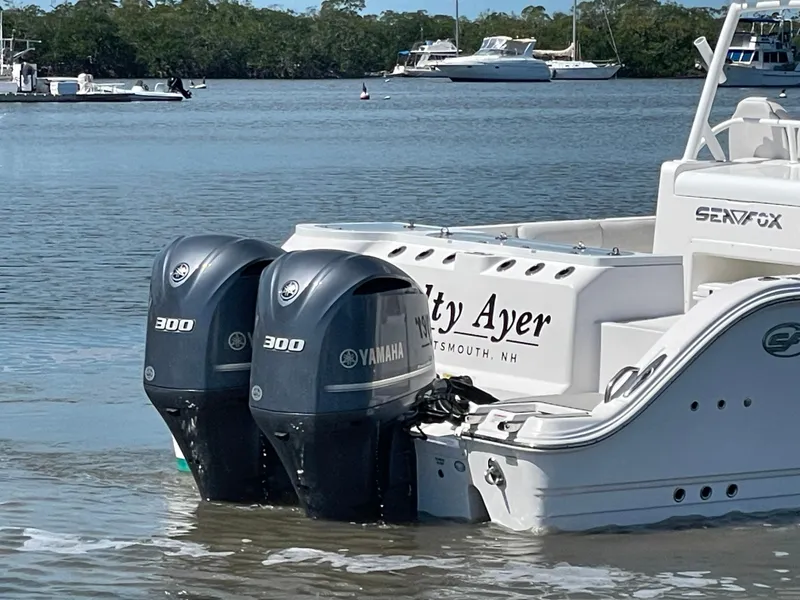 Slide: The Image of 2020 Sea Fox 328 Commander boat with twin Yamaha 300 engines docked in calm waters. - 5
