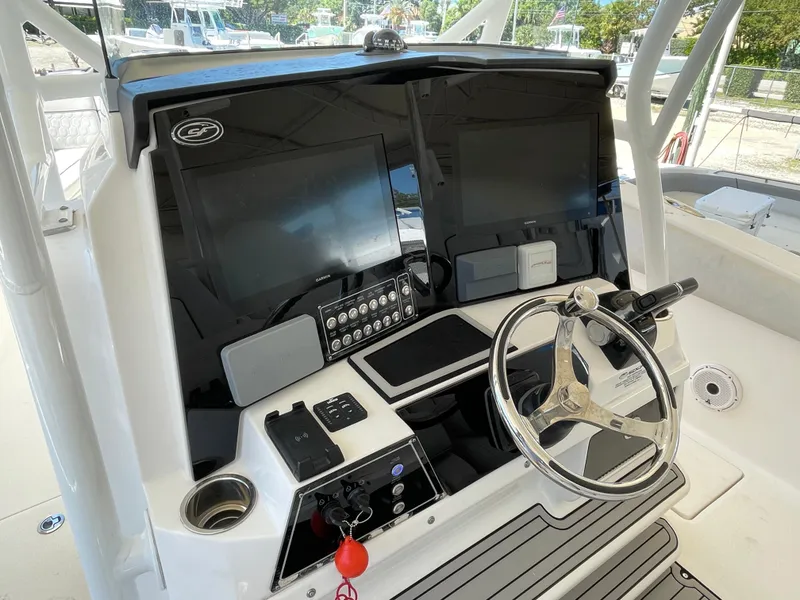 Slide: The Image of 2020 Sea Fox 328 Commander helm with dual screens and modern controls. - 8