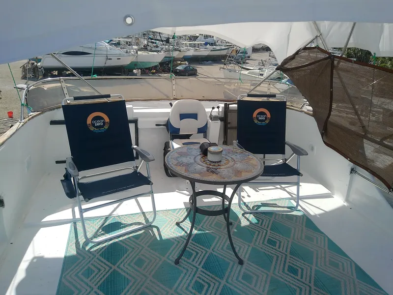 Slide: The Image of 1975 Marine Trader 40 Double Cabin deck with chairs and table, overlooking marina. - 11