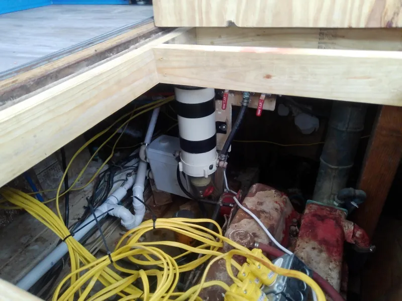 Slide: The Image of Engine room of 1975 Marine Trader 40 Double Cabin with visible wiring and components. - 23