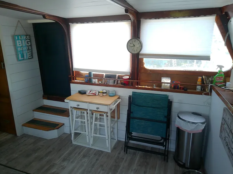 Slide: The Image of Interior of 1975 Marine Trader 40 Double Cabin with wooden accents and compact furniture. - 26