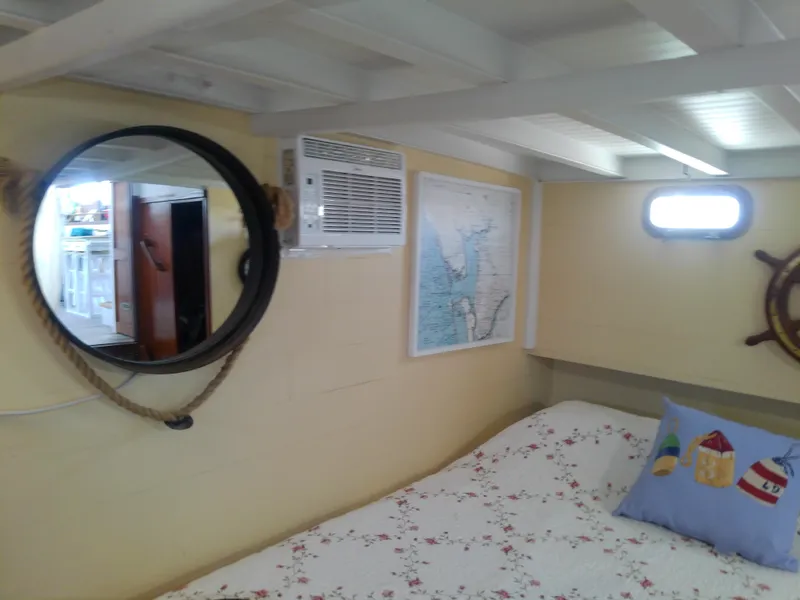 Slide: The Image of Cozy cabin interior of 1975 Marine Trader 40 Double Cabin with nautical decor. - 40